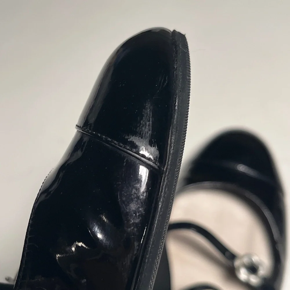 CHANEL Black Patent Leather Flats with Silver Floral Accents - Picture 13 of 14
